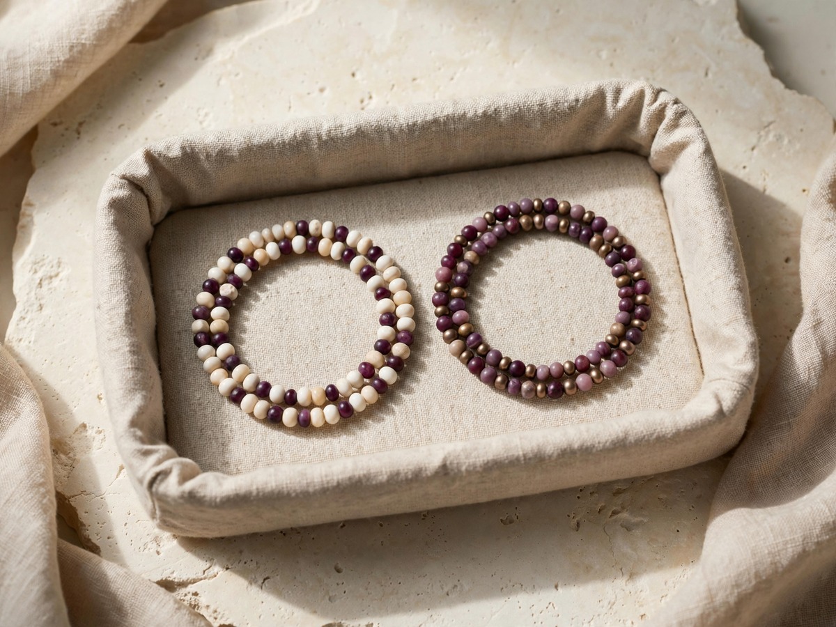 Two finished bead bracelets in a cloth tray
